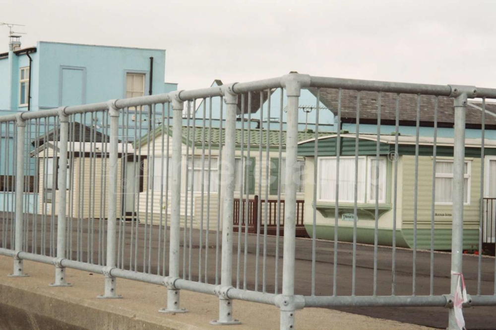 Key clamp fittings and pedestrian barriers used to construct seafront balustrades